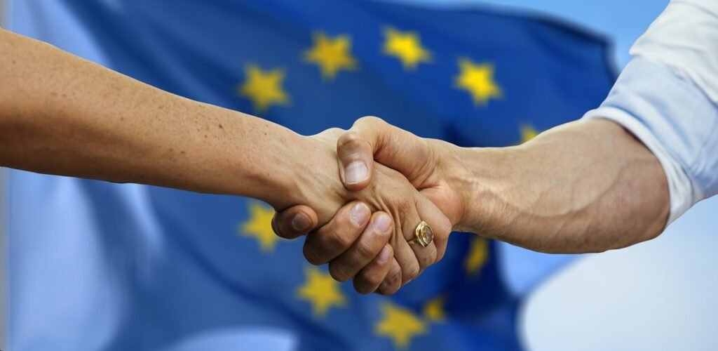 Handshake symbolising EU compliance support and authorised representative services for non-EU manufacturers